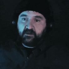a close up of a person 's hand on a dark background .