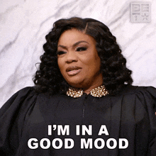 a woman in a black gown says " i 'm in a good mood "
