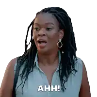a woman with dreadlocks has the word ahh written on her face