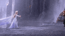 elsa and anna from frozen are standing next to each other