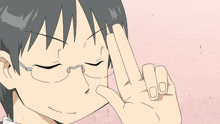a man with glasses is making a peace sign