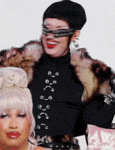 two drag queens are posing for a picture and one of them is wearing a fur coat and sunglasses