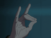 a person 's hand is making a gun gesture with their index finger