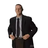 a man in a suit and tie is taking off his jacket made with unscreen