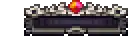 a pixel art illustration of a treasure chest with a red ruby on top .