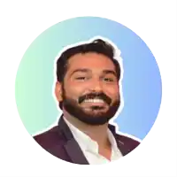 a man with a beard is smiling in a blue and green circle