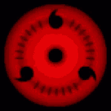 a close up of a red circle with a black center on a black background