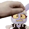 a person is petting a stuffed animal that looks like a bunny rabbit .