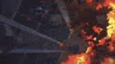 a person is flying through the air with a sword in their hand and a lot of fire coming out of it .