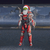 a man in a santa hat is standing on a pole