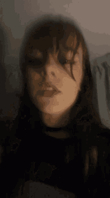 a blurry picture of a girl 's face with a red lip