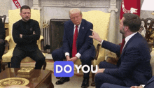 a group of men are sitting around a table with a sticker that says " do you "