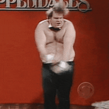 a shirtless man in a bow tie is dancing in front of a sign that says ' philadelphia '