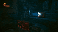 a man sits on a couch under a neon sign that reads facts & lore