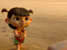 a little girl with pigtails is standing on the beach holding a plant