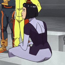 a woman in a purple suit is kneeling down in front of two men