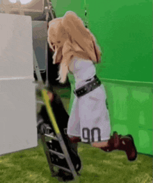a woman wearing shorts with the number 90 on them climbs a ladder