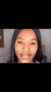 a woman is covering her mouth with her hands while talking to a group of people on a live stream