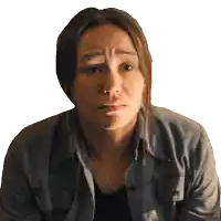 a woman in a denim shirt is making a face