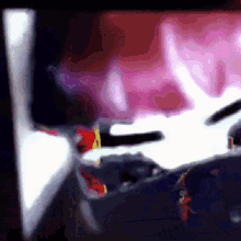 a blurry picture of a person 's face with a red and white background