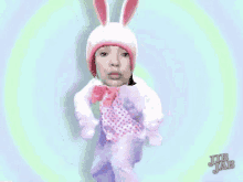 a pixelated image of a woman wearing a bunny hat and bow tie