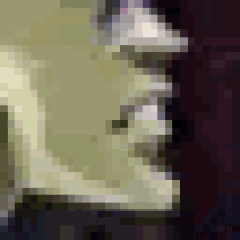 a close up of a person 's face with a blurred background