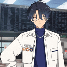 a man with a name tag that says assistant director chirose tsuzura