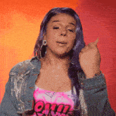 a woman with purple hair is wearing a pink shirt that says ' chill '