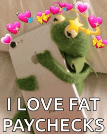 kermit the frog is holding a cell phone with the words i love fat paychecks