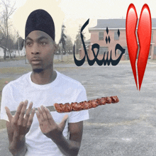 a man is holding a knife and a skewer with a broken heart in the background