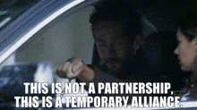 a man and a woman are sitting in a car with the words this is not a partnership