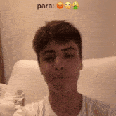 a young man taking a selfie with the word para written on the wall behind him