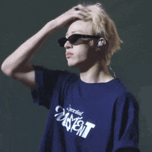 a man wearing sunglasses and a shirt that says ' special event ' on it