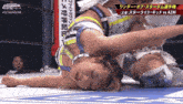 a woman is laying on the ground in a wrestling ring with #stardom on the bottom right