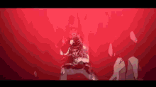 a man is standing in a dark room with a red background .