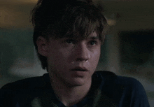 a blurry picture of a man 's face with a light in the background