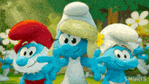 a group of smurfs standing next to each other with the word smurfs on the bottom