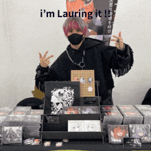 a man wearing a mask stands in front of a table with a sign that says i 'm lauring it