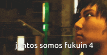 two men are standing next to each other and the words juntos somos fukuin 4 are above them