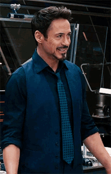 Tony Stark Laugh GIF - Tony Stark Laugh Laughing GIFs