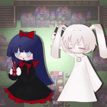 a girl in a black dress and a white girl in a white dress