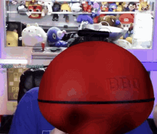 a red ball with the letters bbu on it