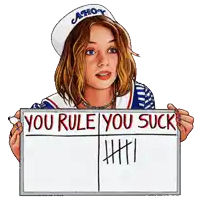 a woman in an ahoy hat holds a sign that says you rule you suck