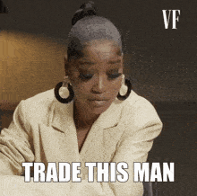 a woman sitting at a table with the words trade this man on her face