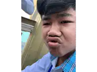 a young man making a funny face with his mouth wide open