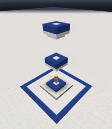 a blue and white block with a green plant on top