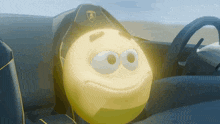 a yellow smiley face in a car with a lamborghini logo on the steering wheel