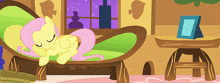 a cartoon of a pony laying on a green chair