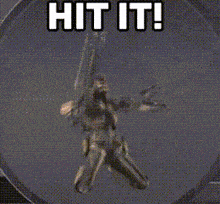 a video game character holding a gun with the words hit it