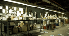 a messy lab with a table full of bottles and plates